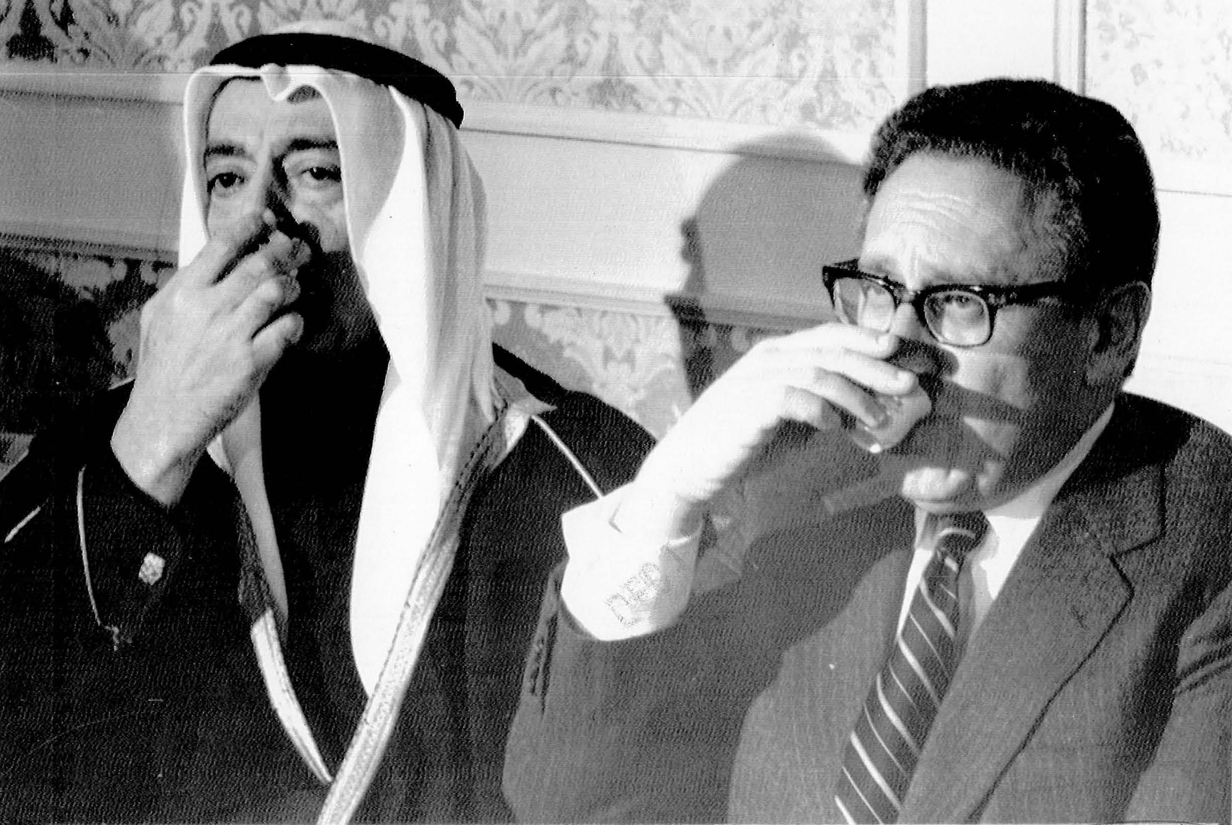 Henry A. Kissinger. (Dec. 12, 1973). Secretary of State sips coffee with Saudi Foreign Minister Omar Sakkaf. AP Wirephoto.